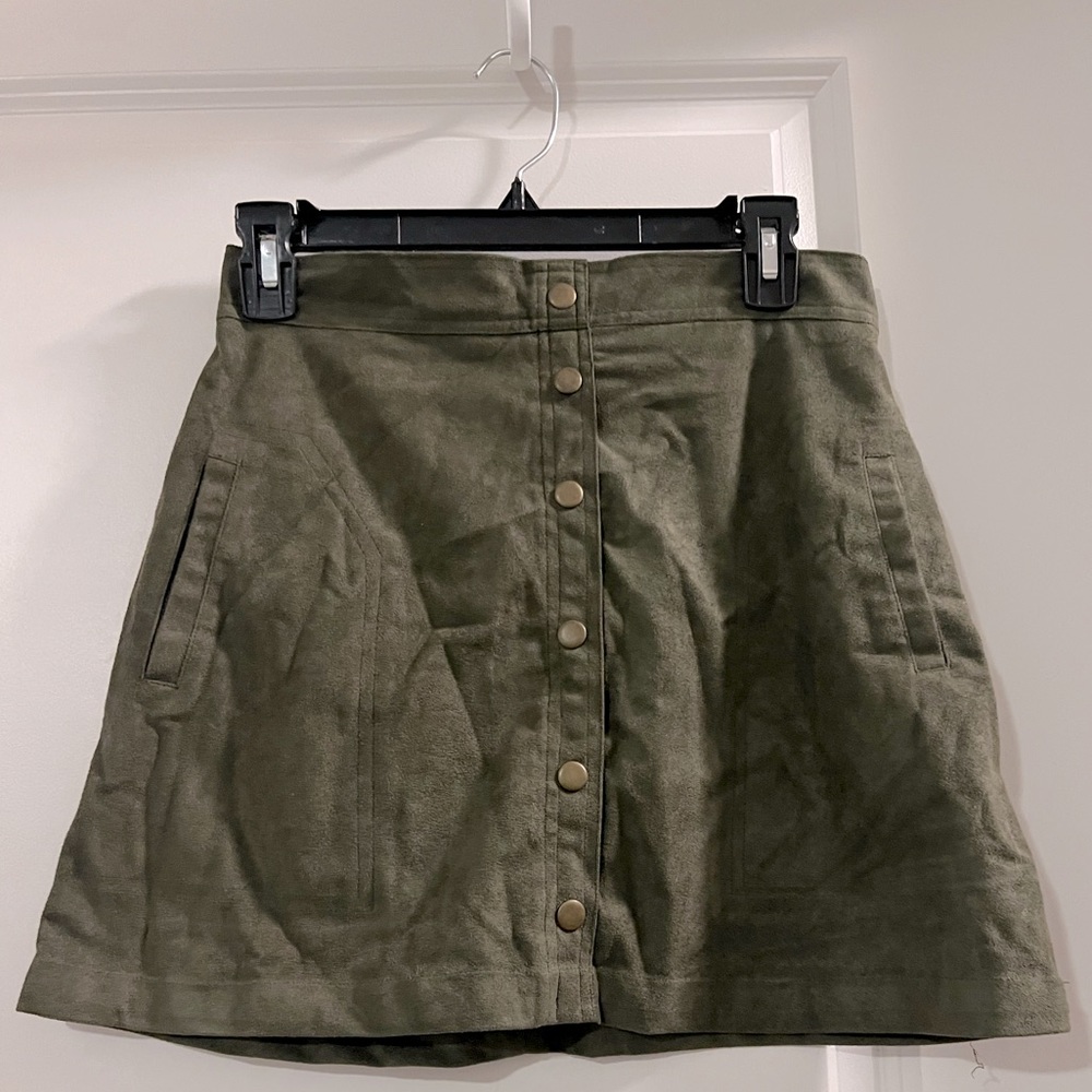 Army green suede mini skirt with bronze buttons and zipper. Size small